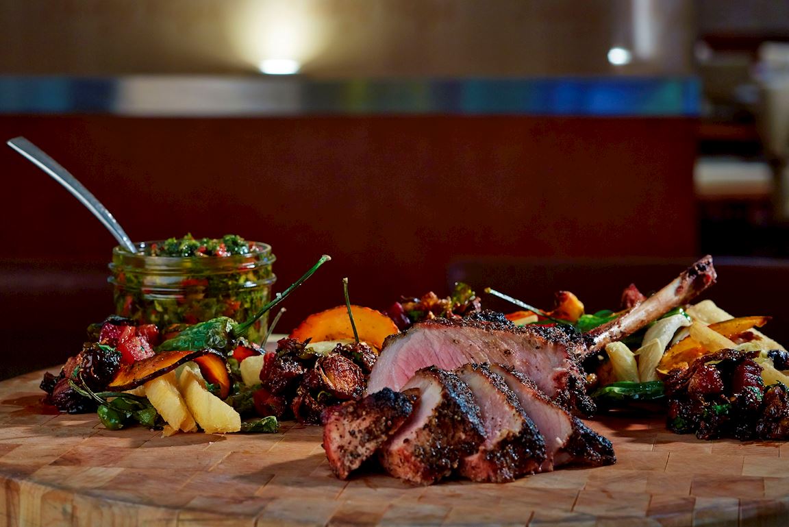 Pork served family style on charcuterie board